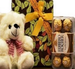 pacco regalo con orsachiotto di peluche e cioccolatini